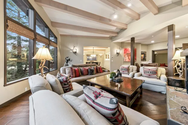 a view of a dining room with furniture wooden floor and chandelier