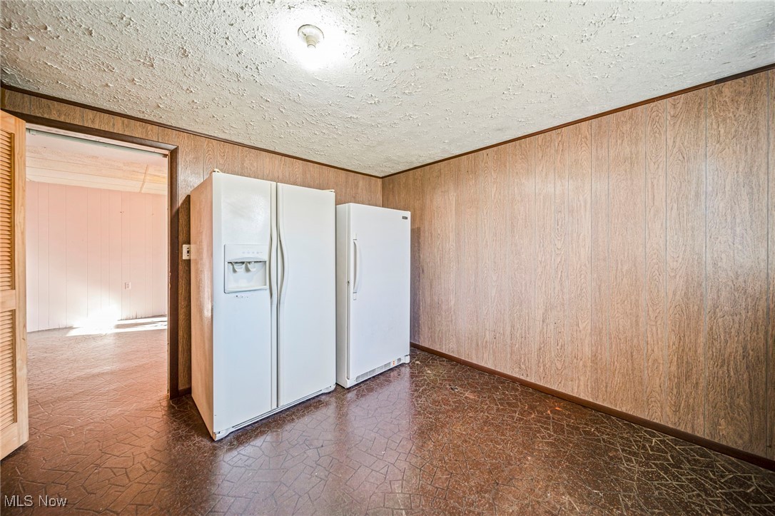 1861 Sterling Road Madison, OH 44057 - Photo 28 of 37 Bonus room 1 with stand up freezer and refrigerator