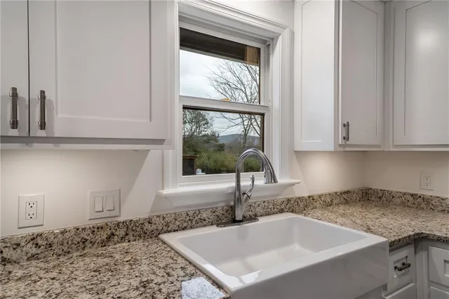 a spacious bedroom with a bed and a fireplace