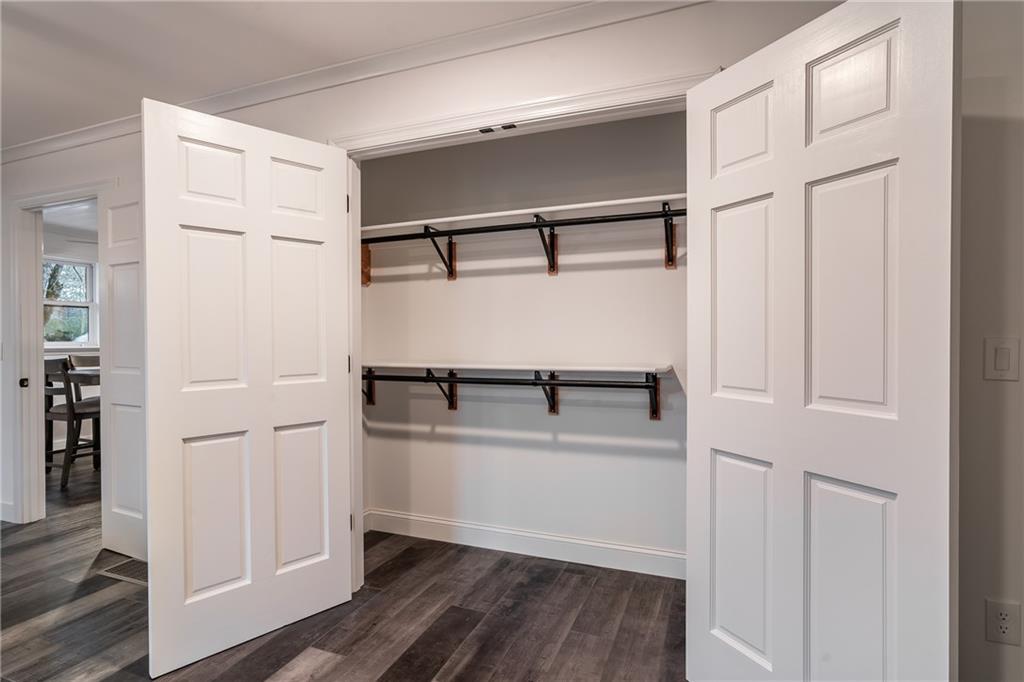 9351 Henderson Mountain Road Fairmount, GA 30139 - Photo 29 of 60 a view of walk in closet with empty racks
