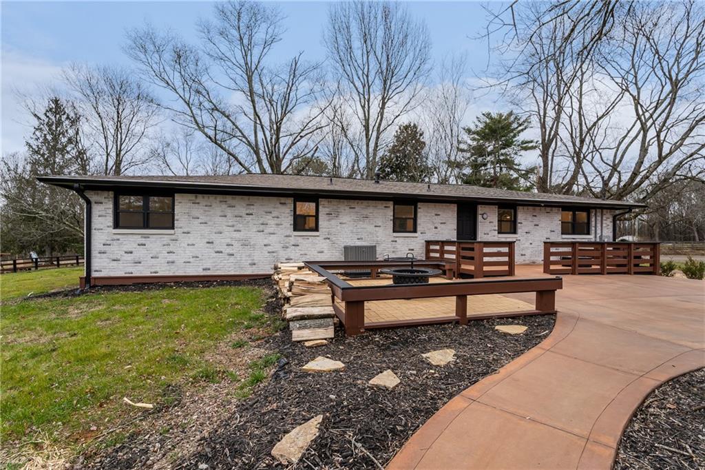 9351 Henderson Mountain Road Fairmount, GA 30139 - Photo 41 of 60 a front view of a house with yard and sitting area