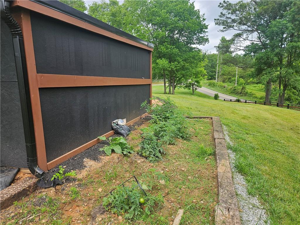 9351 Henderson Mountain Road Fairmount, GA 30139 - Photo 56 of 60 a backyard of a house with a yard and outdoor seating