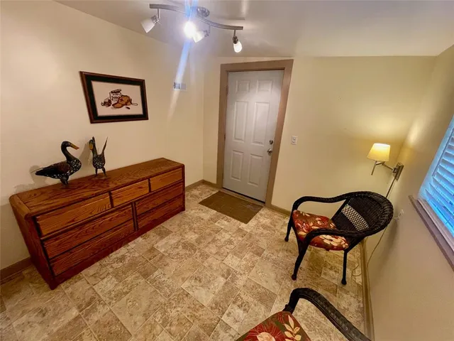a kitchen with a stove sink and cabinets