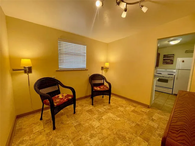a kitchen with granite countertop a sink and a stove top oven