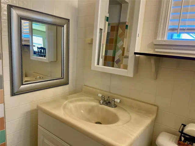 a bedroom with a couch and a rug