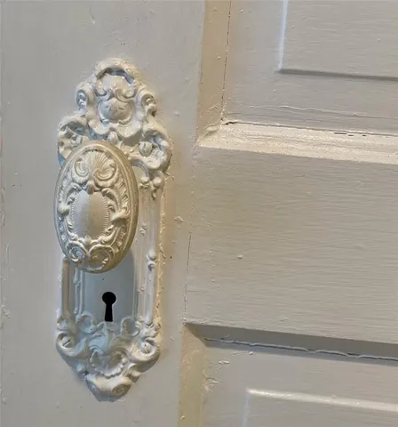 a view of a hallway with paintings on the wall