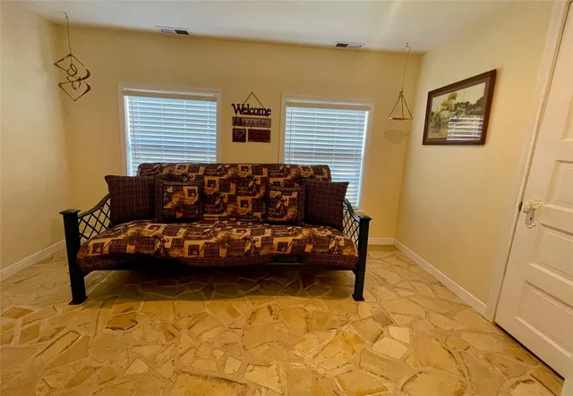 a view of swimming pool with table and chairs under an umbrella