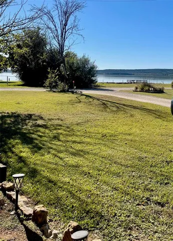 a living room with furniture and a lamp