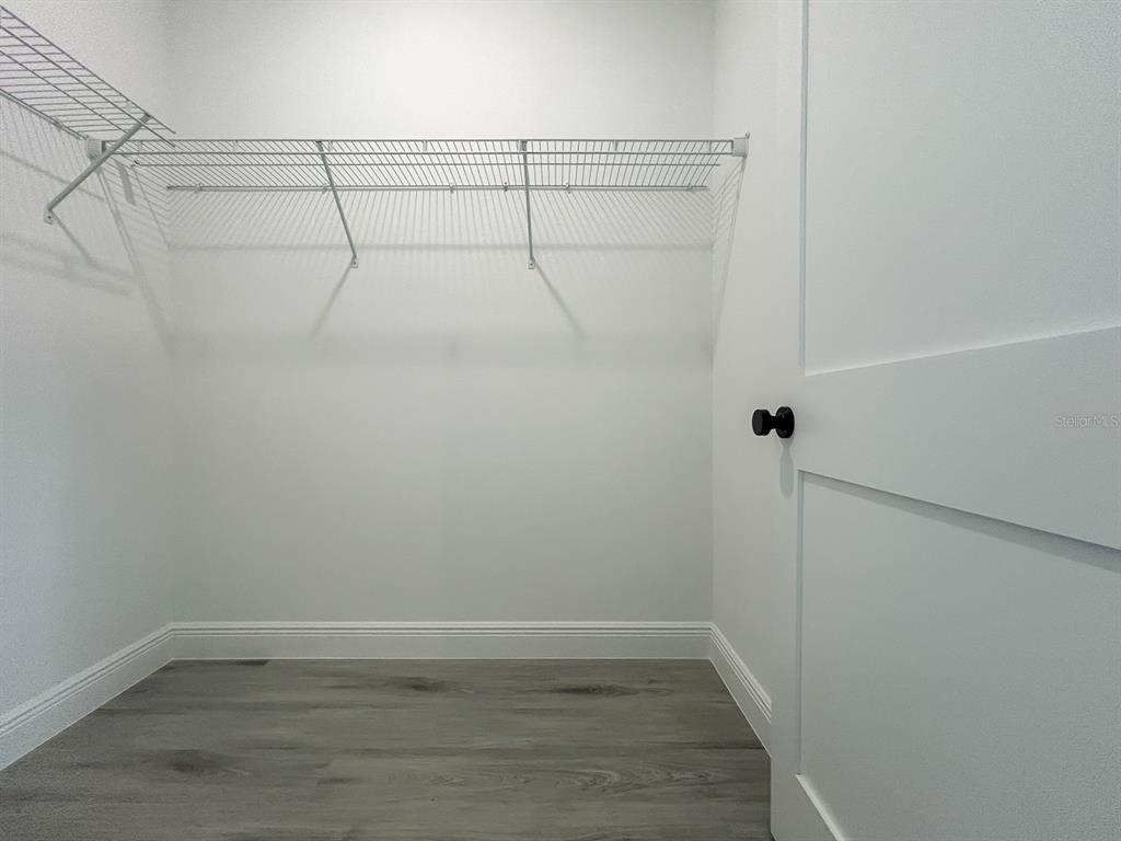 3159 Southwest 127th Lane Road Ocala, FL 34473 - Photo 15 of 32 a view of a room with racks on the wall