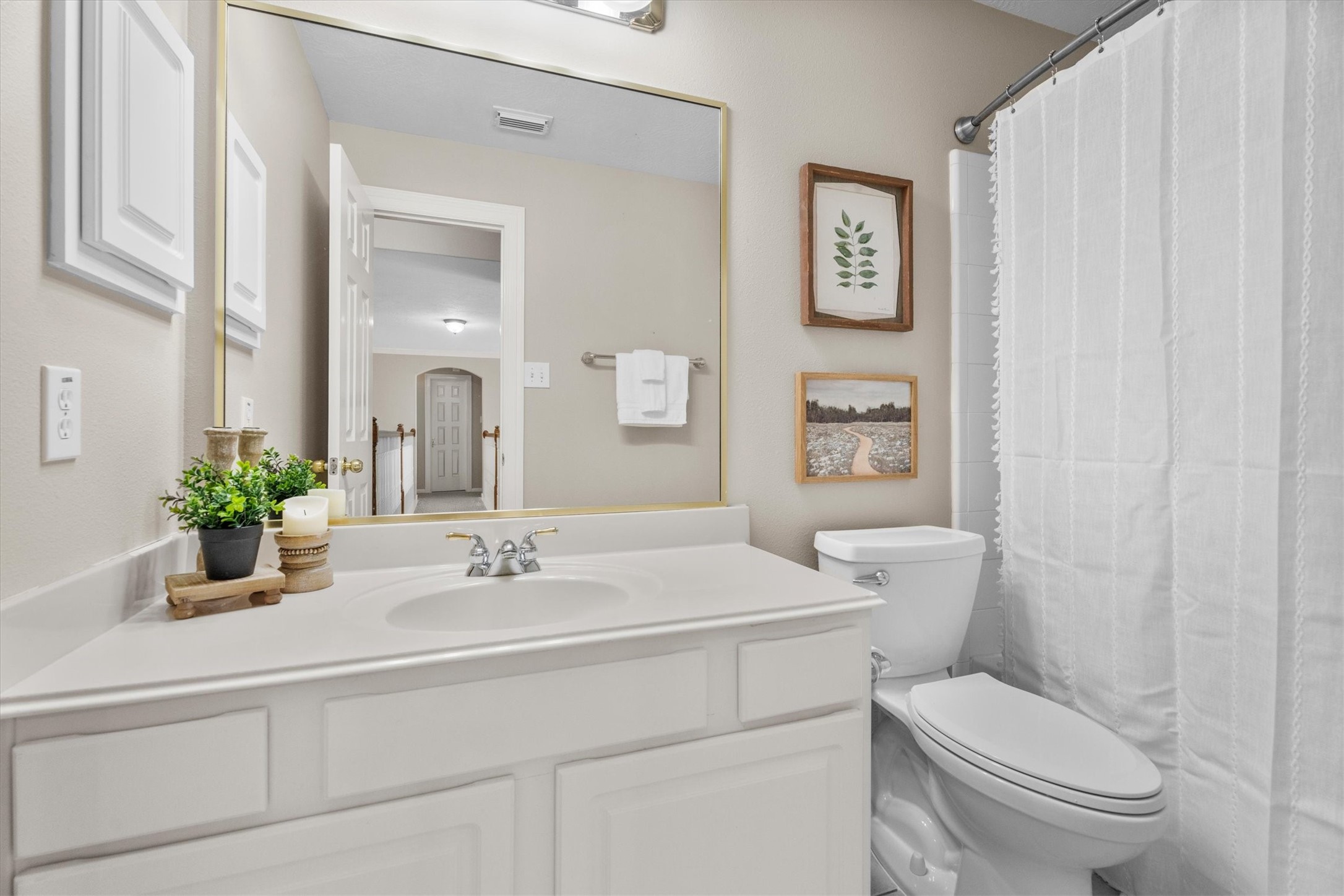 6323 Stone Trail Lane Spring, TX 77379 - Photo 23 of 43 a bathroom with a sink a toilet and a mirror