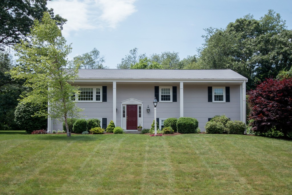 21 Spruce Road Medway, MA 02053 - Photo 1 of 26 a front view of a house with garden