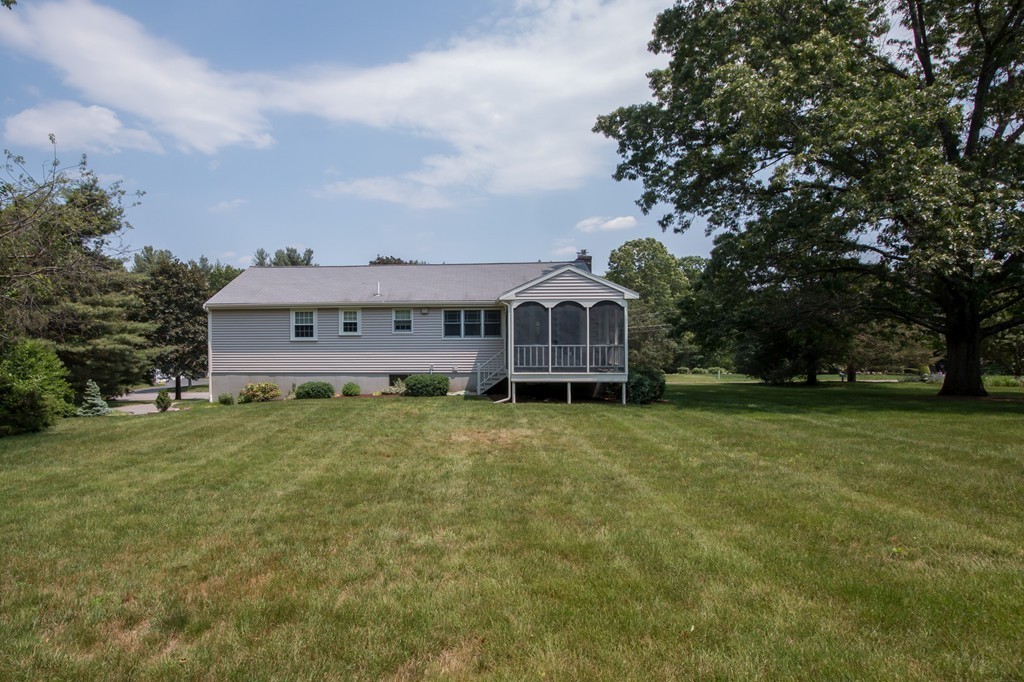 21 Spruce Road Medway, MA 02053 - Photo 24 of 26 a view of a house with a big yard and large trees