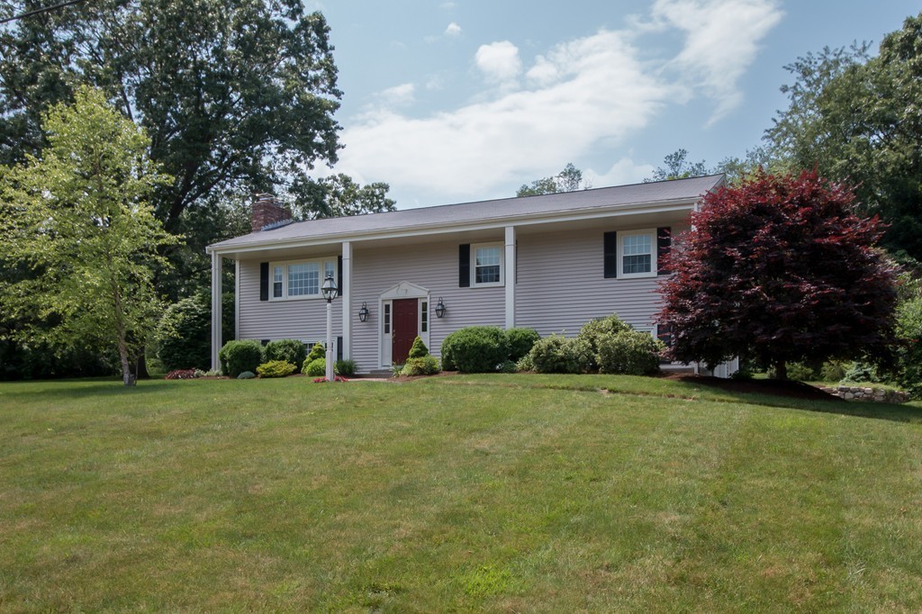 21 Spruce Road Medway, MA 02053 - Photo 26 of 26 a front view of a house with a yard and garage
