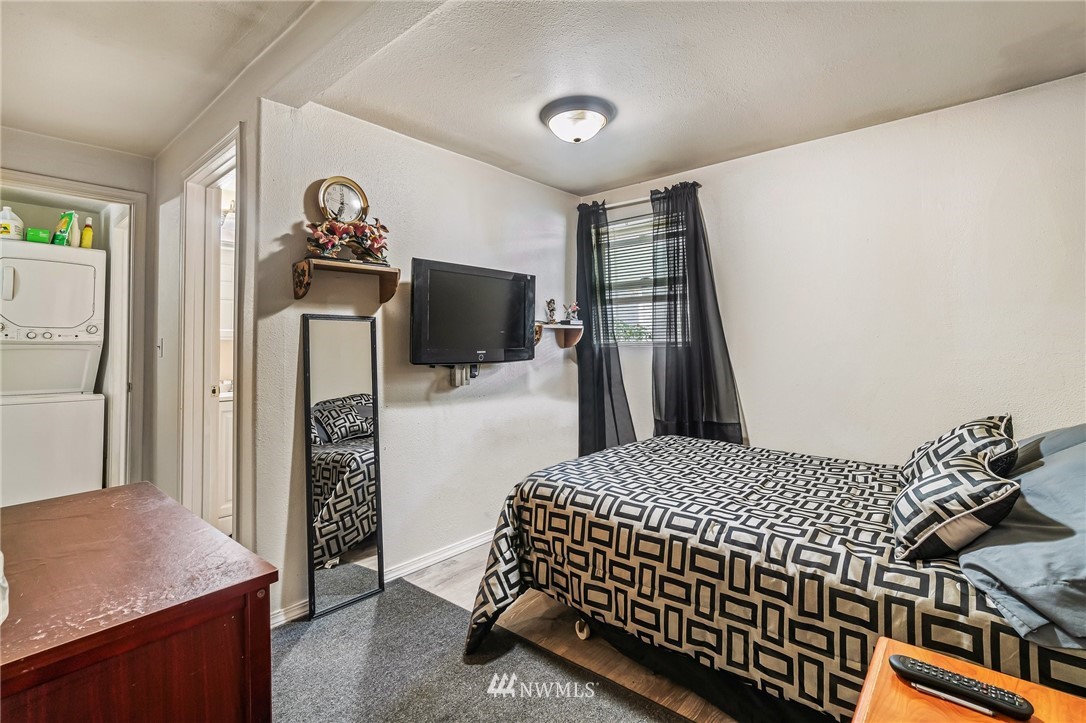 1915 Gibson Road, Unit A Everett, WA 98204 - Photo 14 of 23 a bedroom with a bed and a flat screen tv