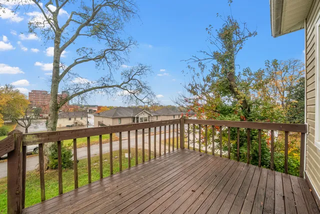 a view of a balcony with wooden floor