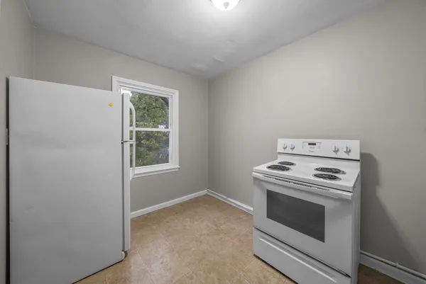 a kitchen with a stove and a microwave
