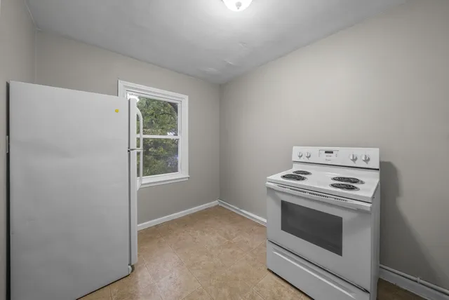 a kitchen with a stove and a microwave