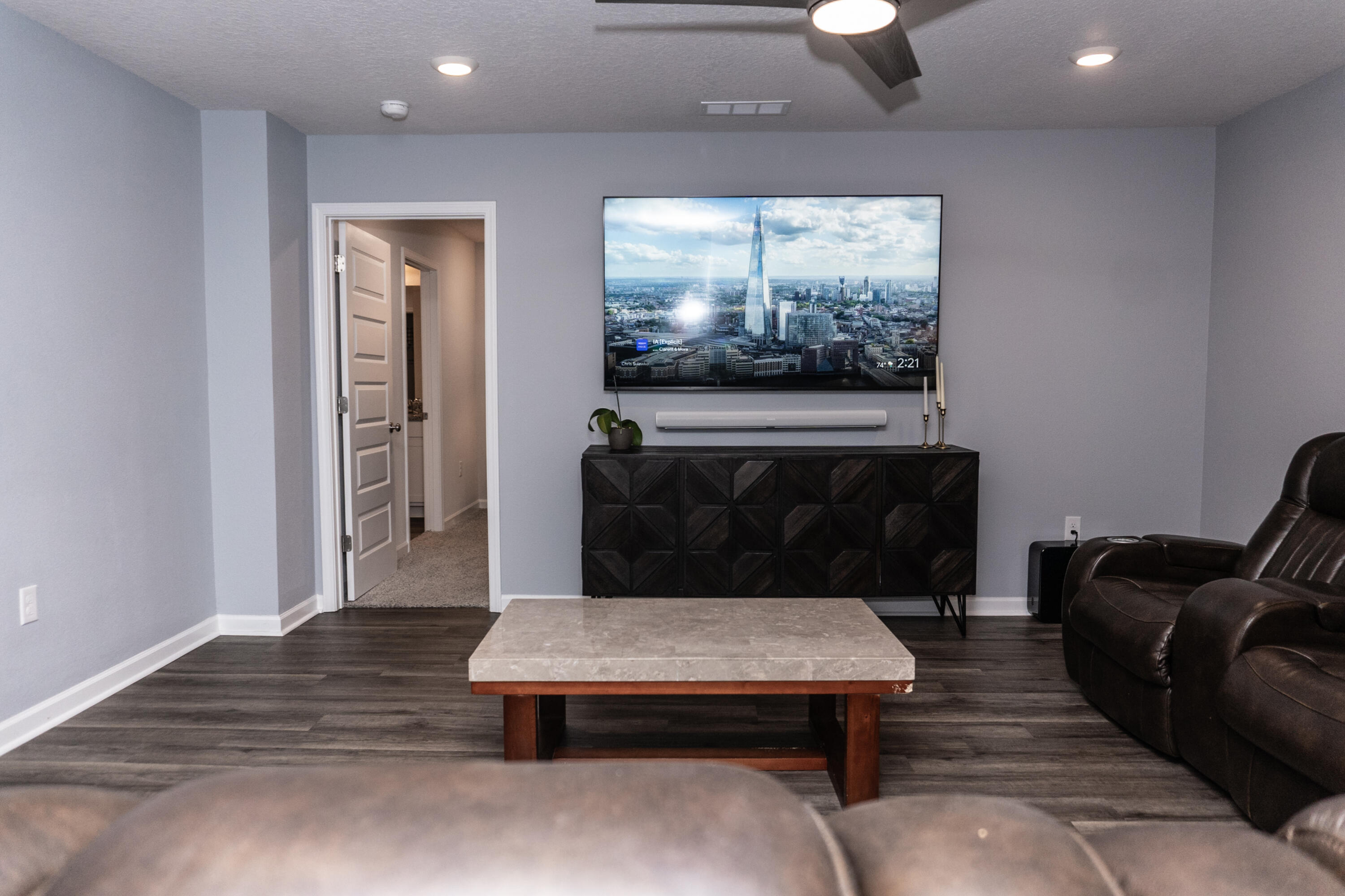 3431 Phoenix Court Crestview, FL 32539 - Photo 12 of 29 a living room with furniture a flat screen tv and a fireplace