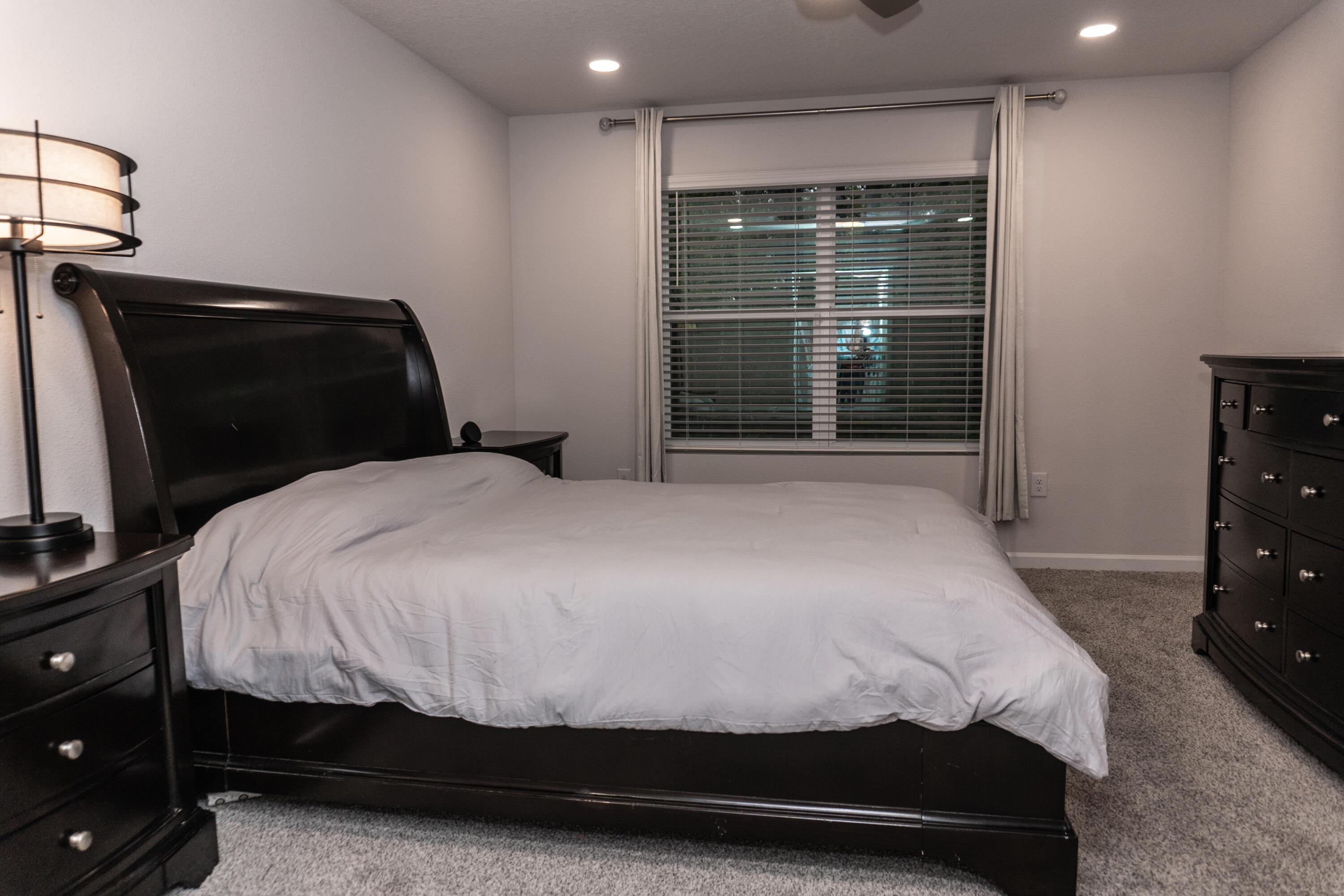 3431 Phoenix Court Crestview, FL 32539 - Photo 13 of 29 a bedroom with a bed and a tv