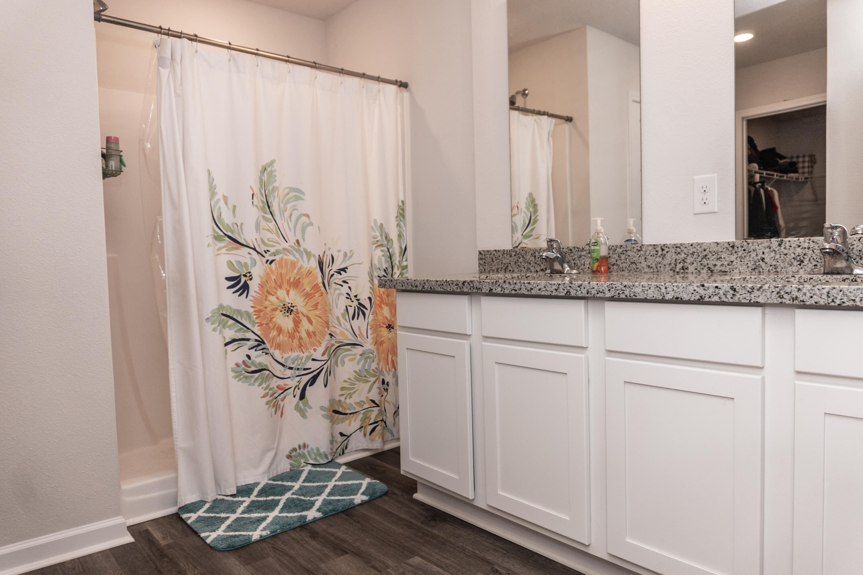 3431 Phoenix Court Crestview, FL 32539 - Photo 15 of 29 a bathroom with a granite countertop sink and a mirror