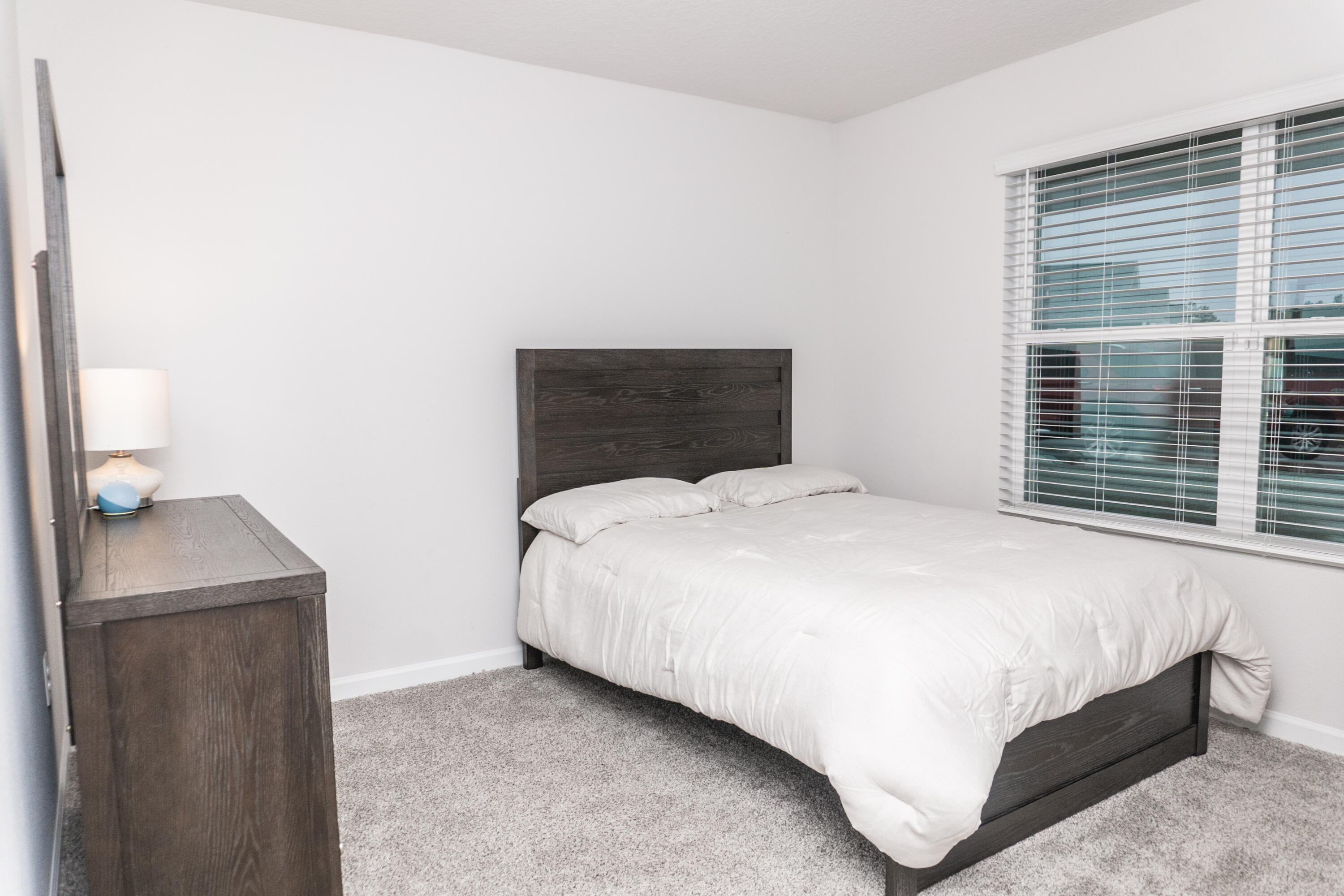 3431 Phoenix Court Crestview, FL 32539 - Photo 19 of 29 a bedroom with a bed and a window