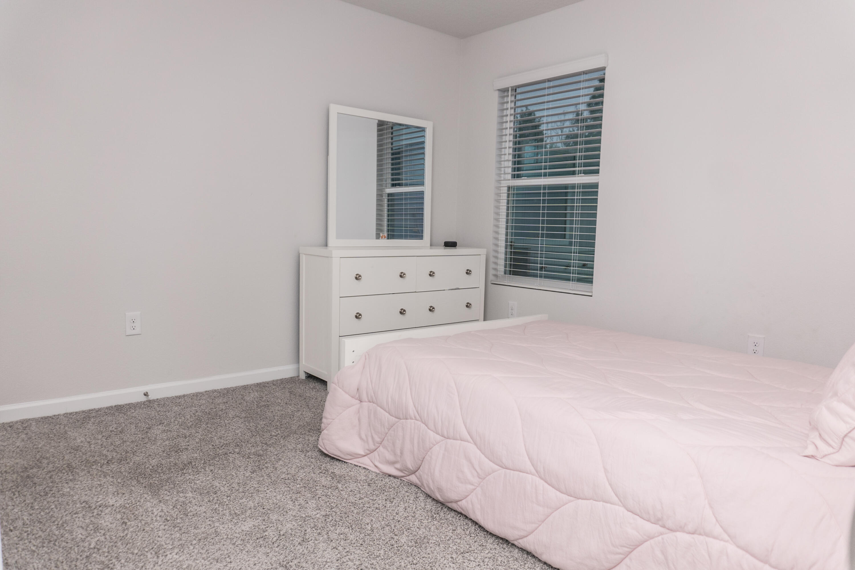 3431 Phoenix Court Crestview, FL 32539 - Photo 22 of 29 a bedroom with a bed and a window