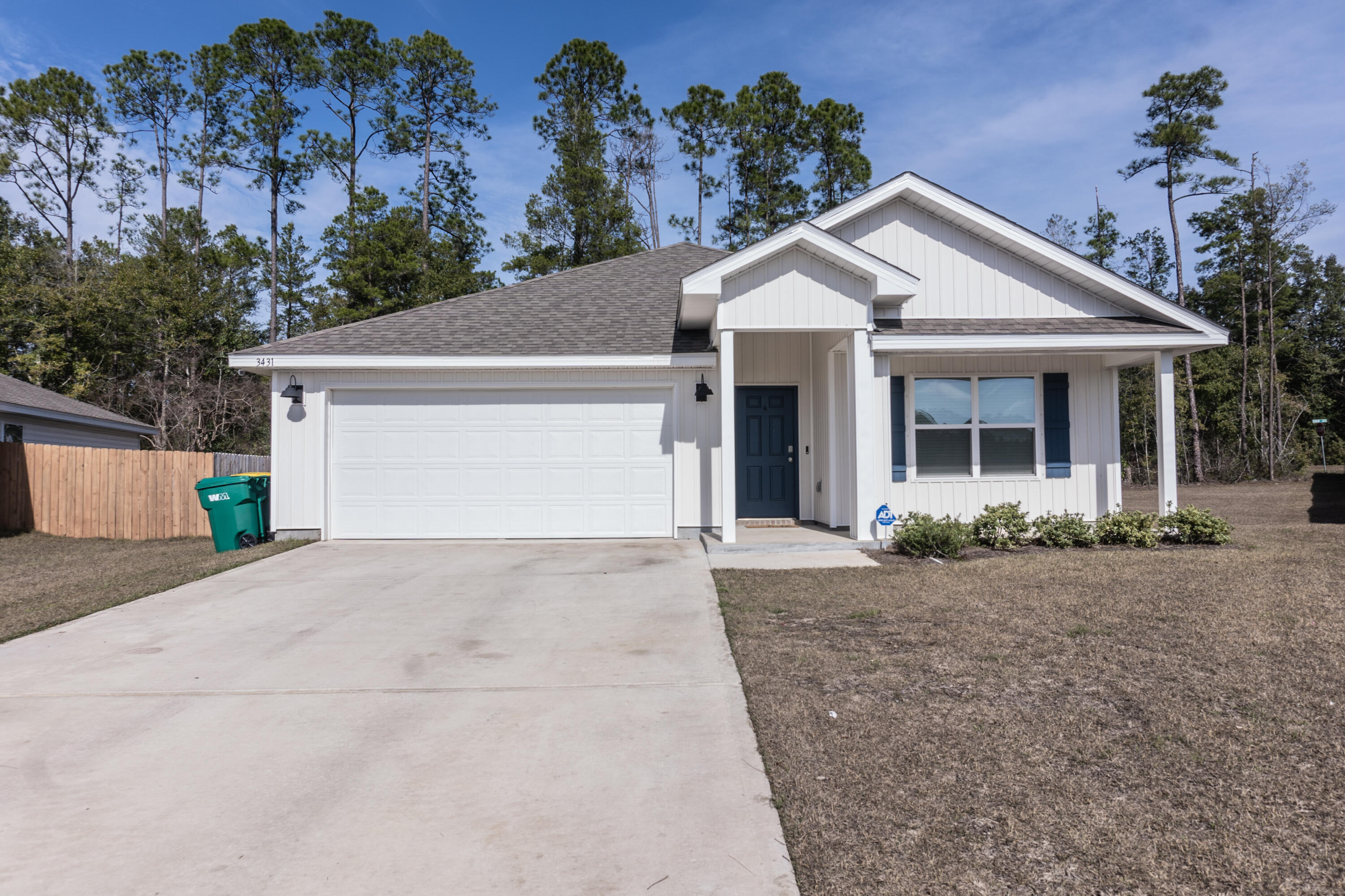 3431 Phoenix Court Crestview, FL 32539 - Photo 3 of 29 a view of a white house with a yard and potted plants