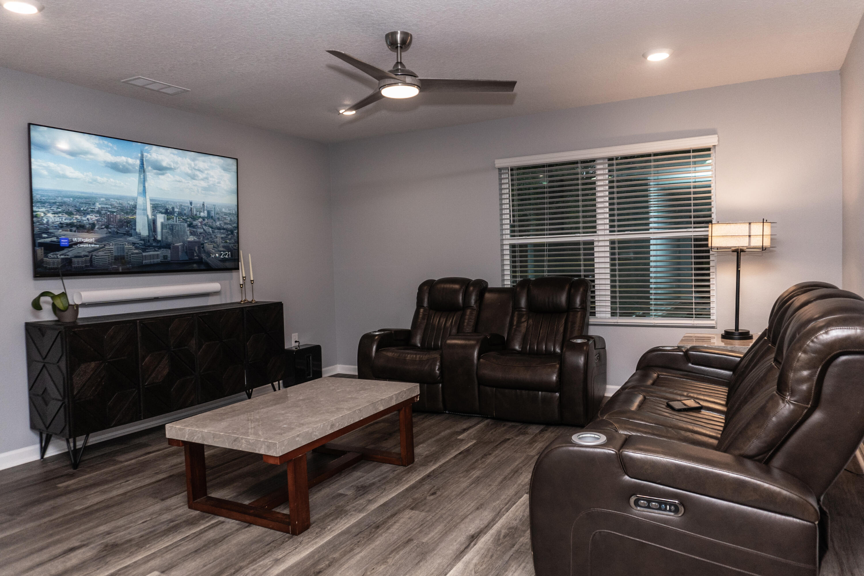 3431 Phoenix Court Crestview, FL 32539 - Photo 10 of 29 a living room with furniture a flat screen tv and a window