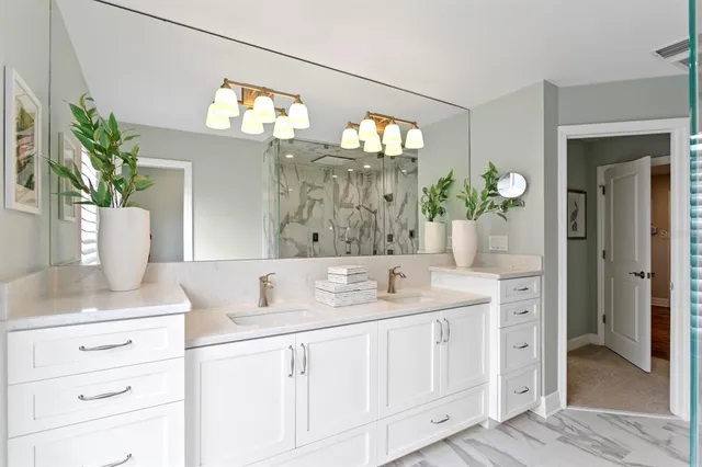 a bathroom with a sink a vanity and a mirror