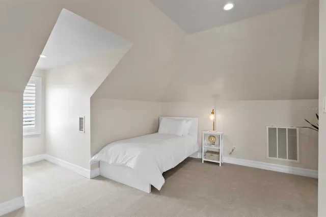 a bedroom with a bed and a cabinets