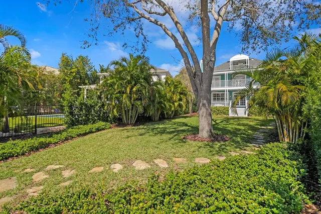 a backyard of a house with lots of green space