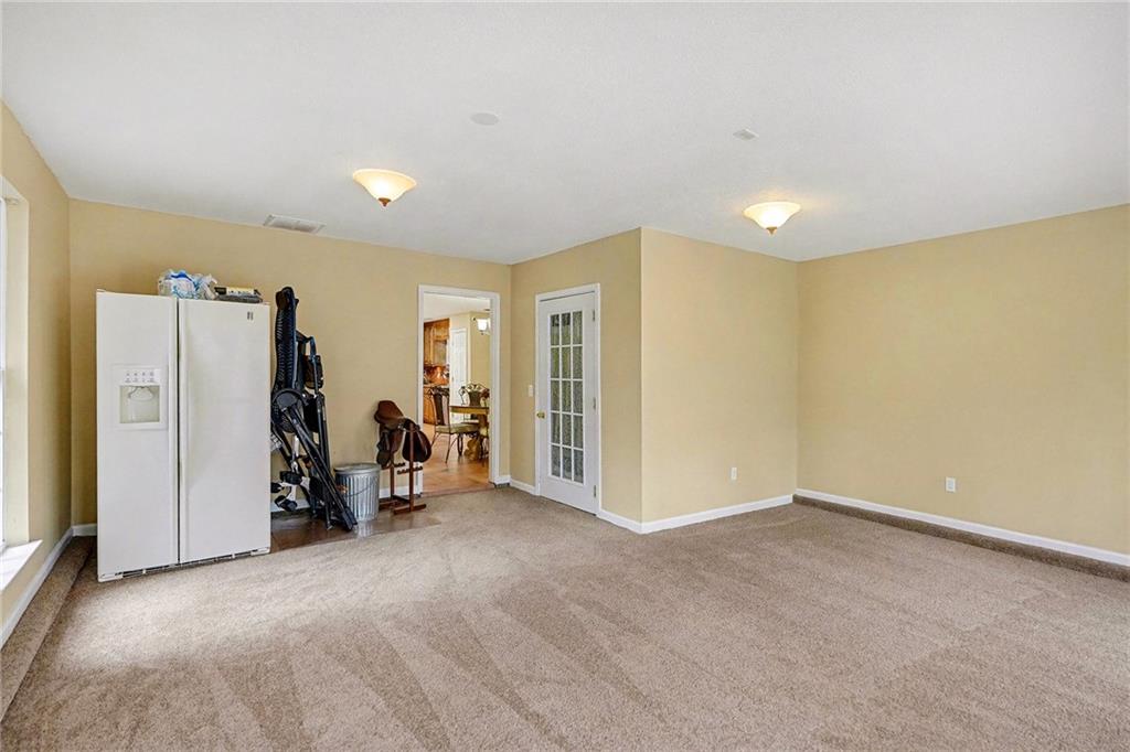 235 Cecil Jackson Road Griffin, GA 30223 - Photo 16 of 34 a view of a room with gym equipment