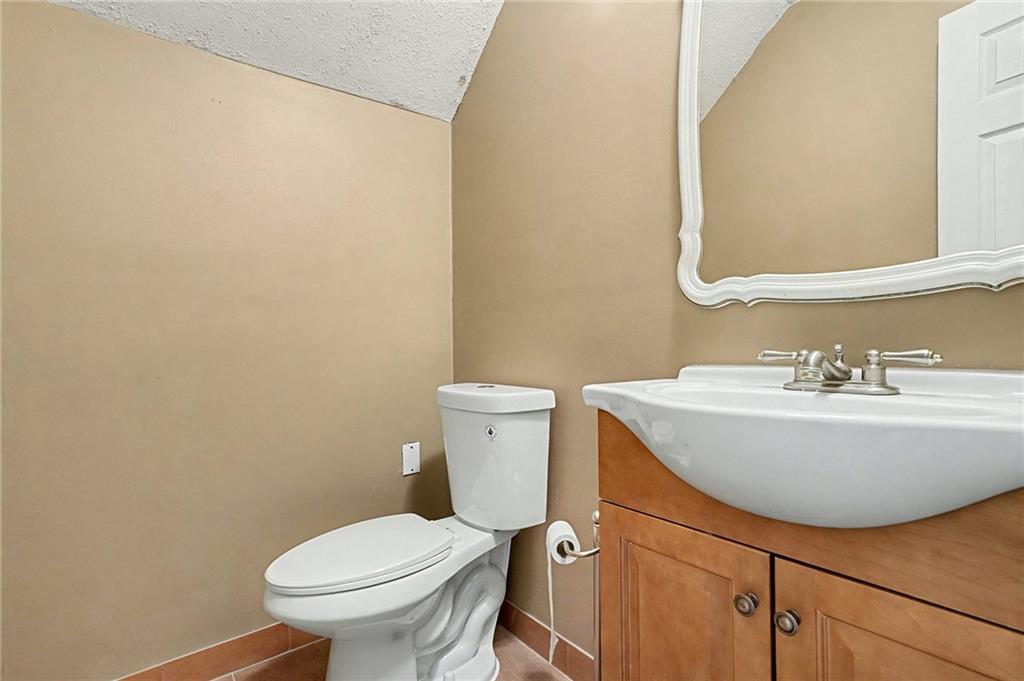235 Cecil Jackson Road Griffin, GA 30223 - Photo 27 of 34 a bathroom with a sink and a mirror
