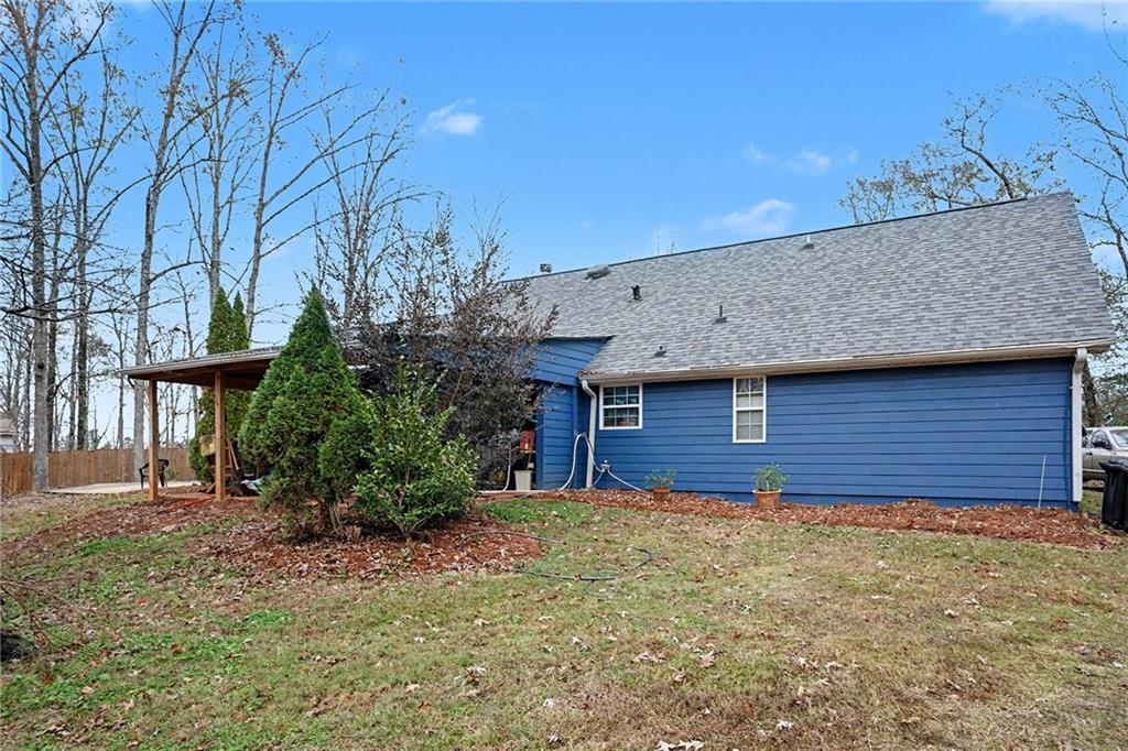 235 Cecil Jackson Road Griffin, GA 30223 - Photo 31 of 34 a view of a house with a yard