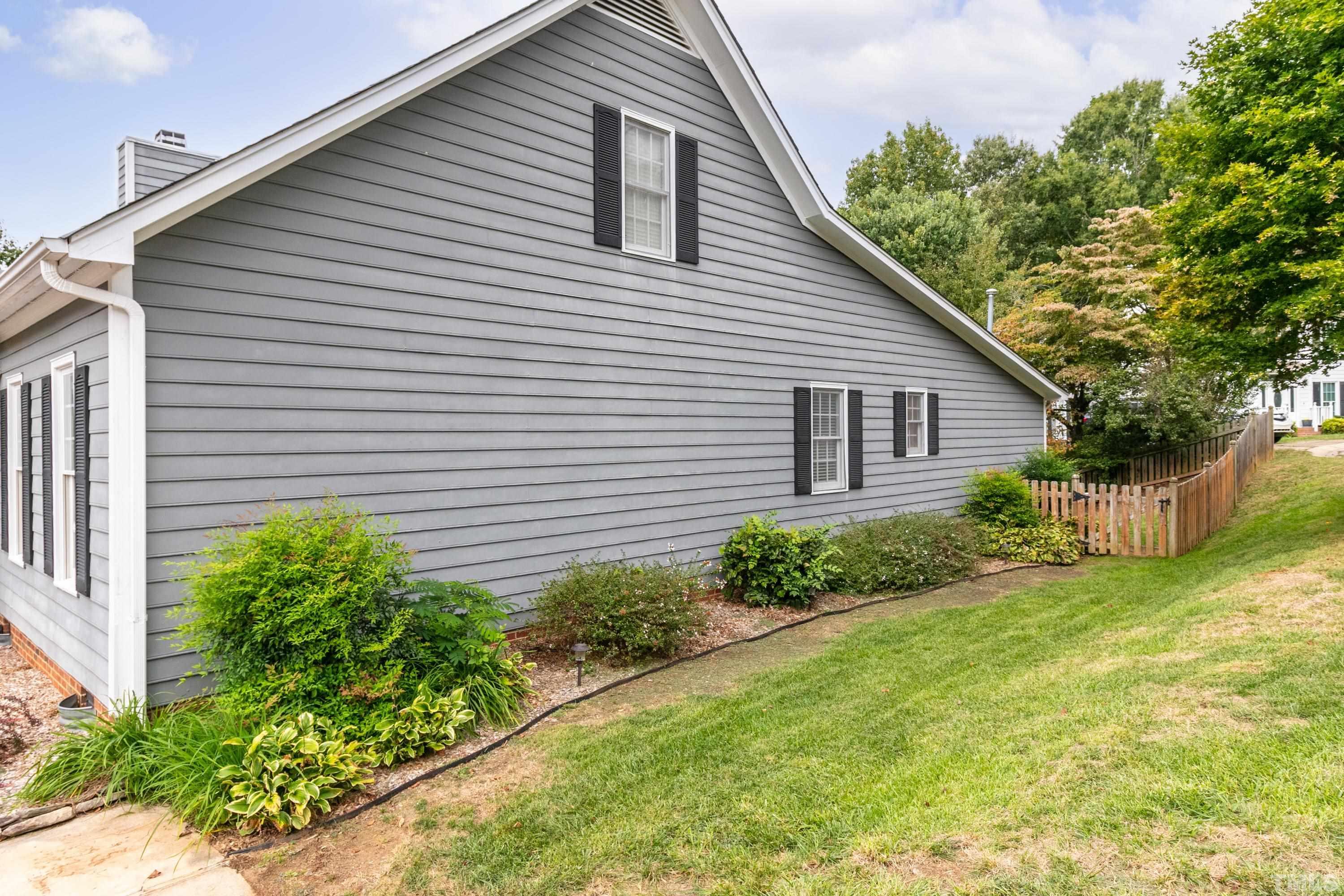 2224 Leadenhall Way Raleigh, NC 27603 - Photo 22 of 30 a view of a house with a yard and plants