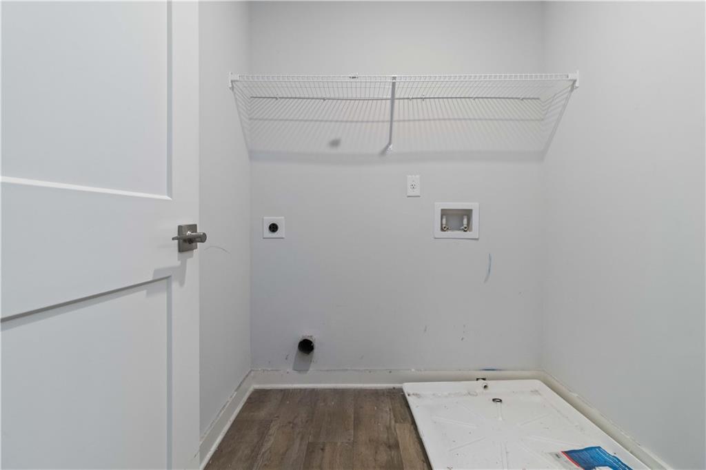 163 Kingfisher Walk Covington, GA 30014 - Photo 24 of 41 a view of a room with racks on the wall