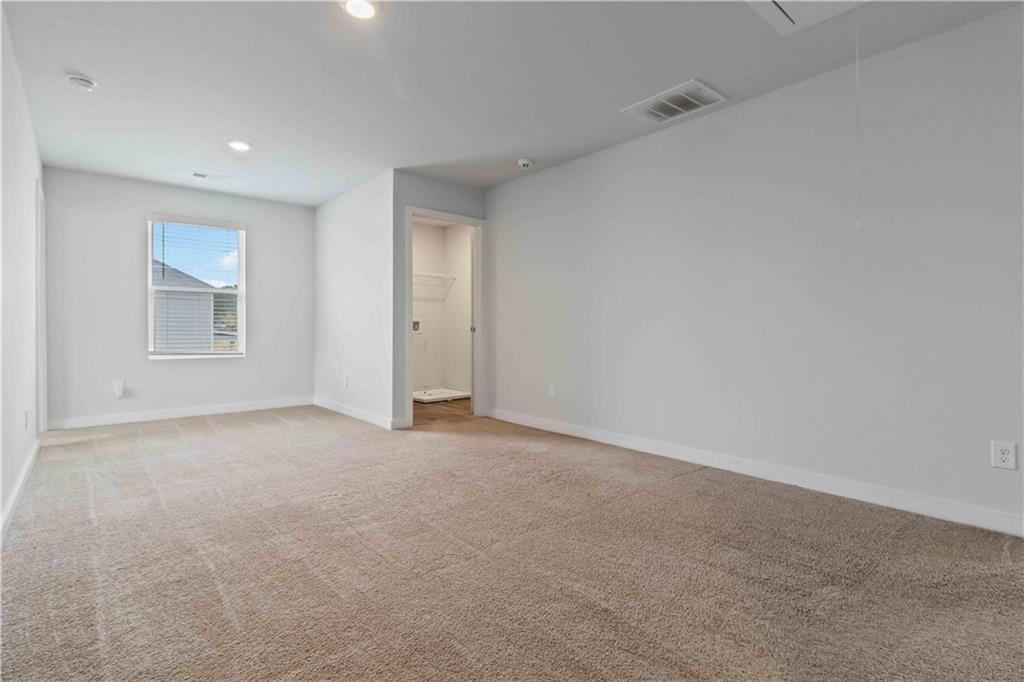 163 Kingfisher Walk Covington, GA 30014 - Photo 26 of 41 a view of an empty room with a window