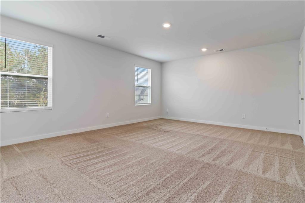 163 Kingfisher Walk Covington, GA 30014 - Photo 29 of 41 a view of an empty room with a window