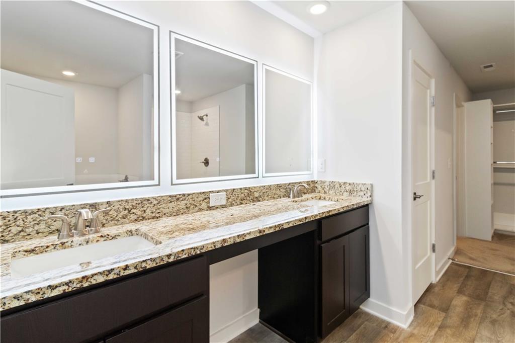 163 Kingfisher Walk Covington, GA 30014 - Photo 31 of 41 a bathroom with a granite countertop sink and a mirror