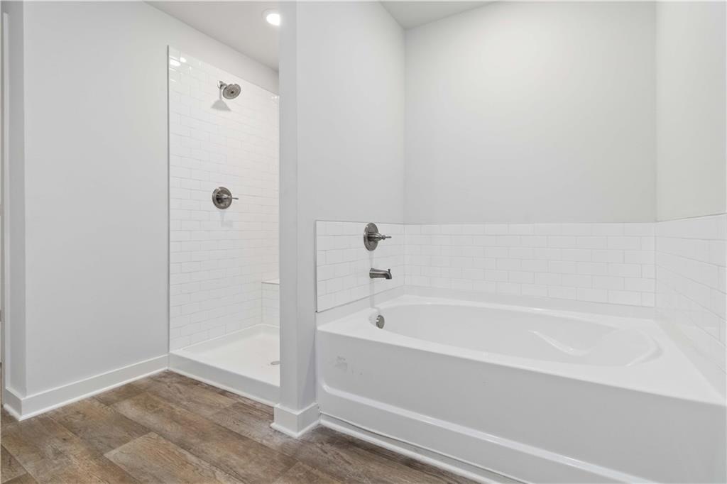 163 Kingfisher Walk Covington, GA 30014 - Photo 32 of 41 a bathroom with a bathtub