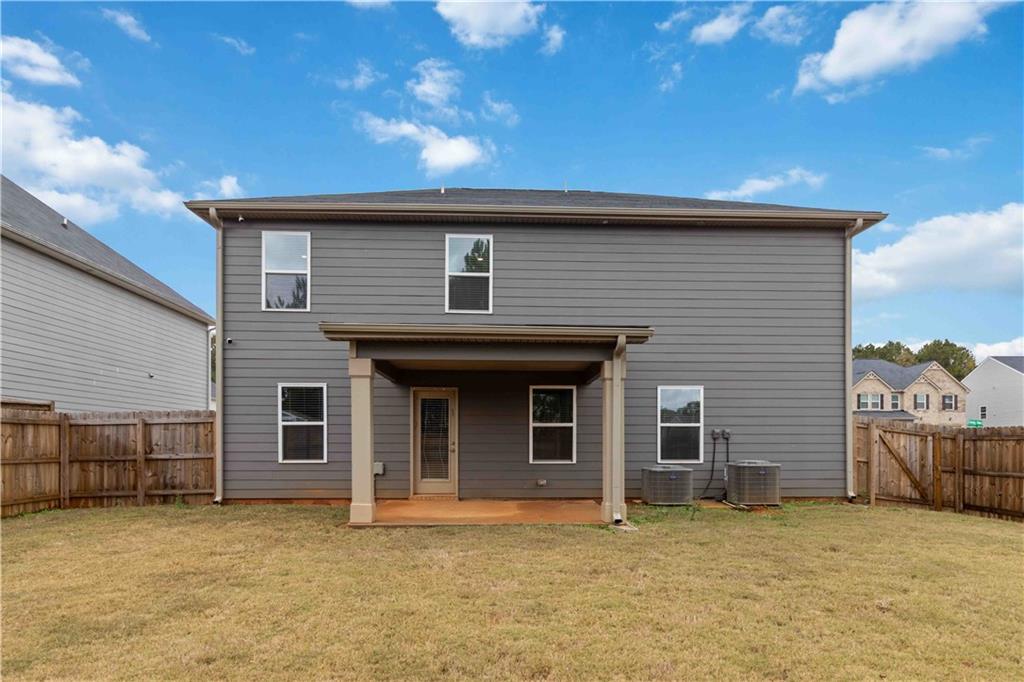 163 Kingfisher Walk Covington, GA 30014 - Photo 37 of 41 a backyard of a house with oven