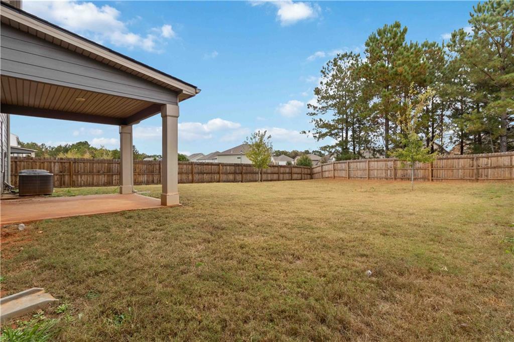 163 Kingfisher Walk Covington, GA 30014 - Photo 40 of 41 a view of a patio with a yard
