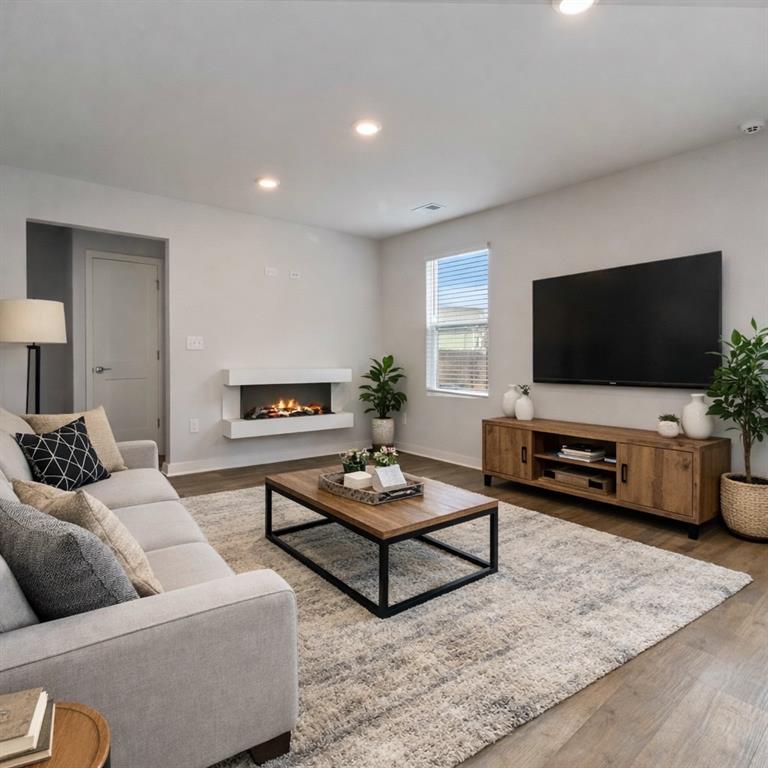 163 Kingfisher Walk Covington, GA 30014 - Photo 8 of 41 a living room with furniture and a flat screen tv