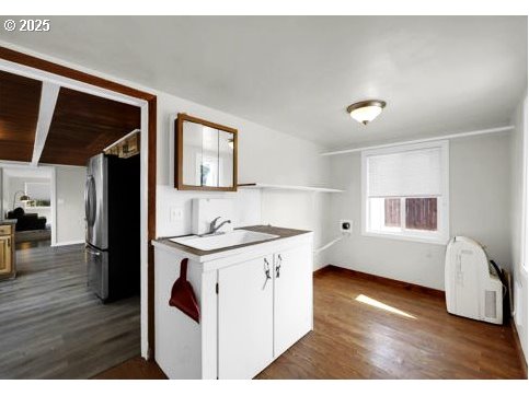 3090 Willakenzie Road Eugene, OR 97401 - Photo 13 of 22 a kitchen with a stove a refrigerator and a microwave oven with wooden floor