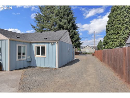 3090 Willakenzie Road Eugene, OR 97401 - Photo 22 of 22 a view of a house with a backyard
