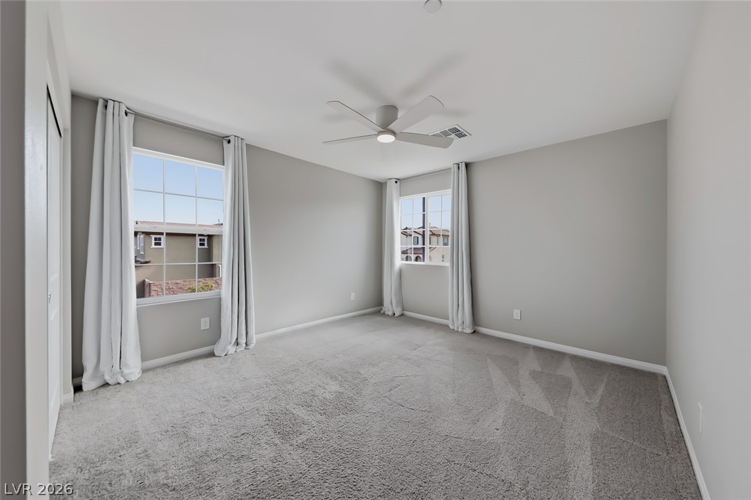 3564 Credere Lane Henderson, NV 89074 - Photo 29 of 40 Unfurnished bedroom with light colored carpet and a ceiling fan