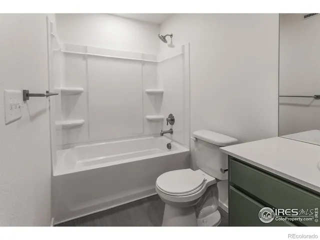 a bathroom with a toilet a sink and bathtub