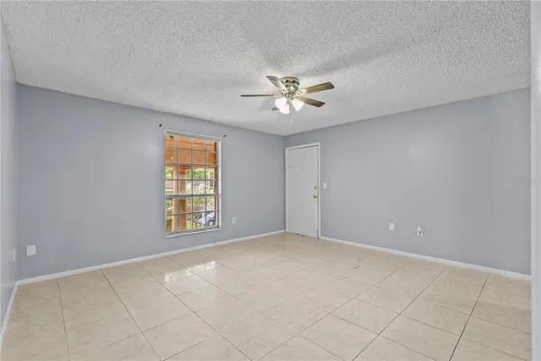 a view of an empty room with a window