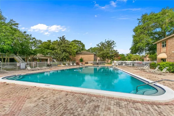 a view of a swimming pool with a yard