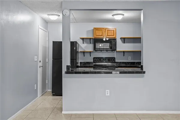 a kitchen with stainless steel appliances a refrigerator and a stove